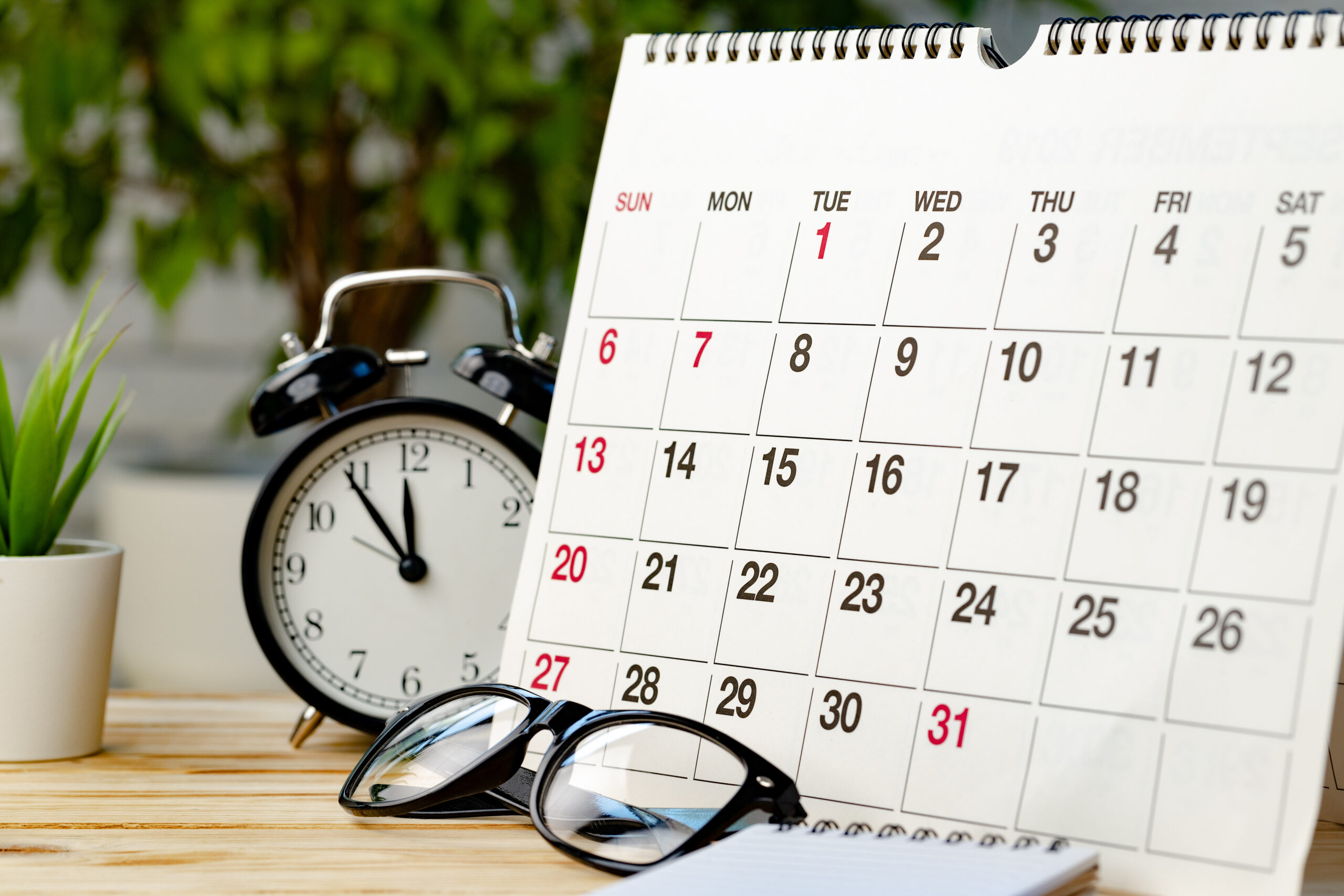 Calendar and Clock Signifying Open Enrollment Timeline