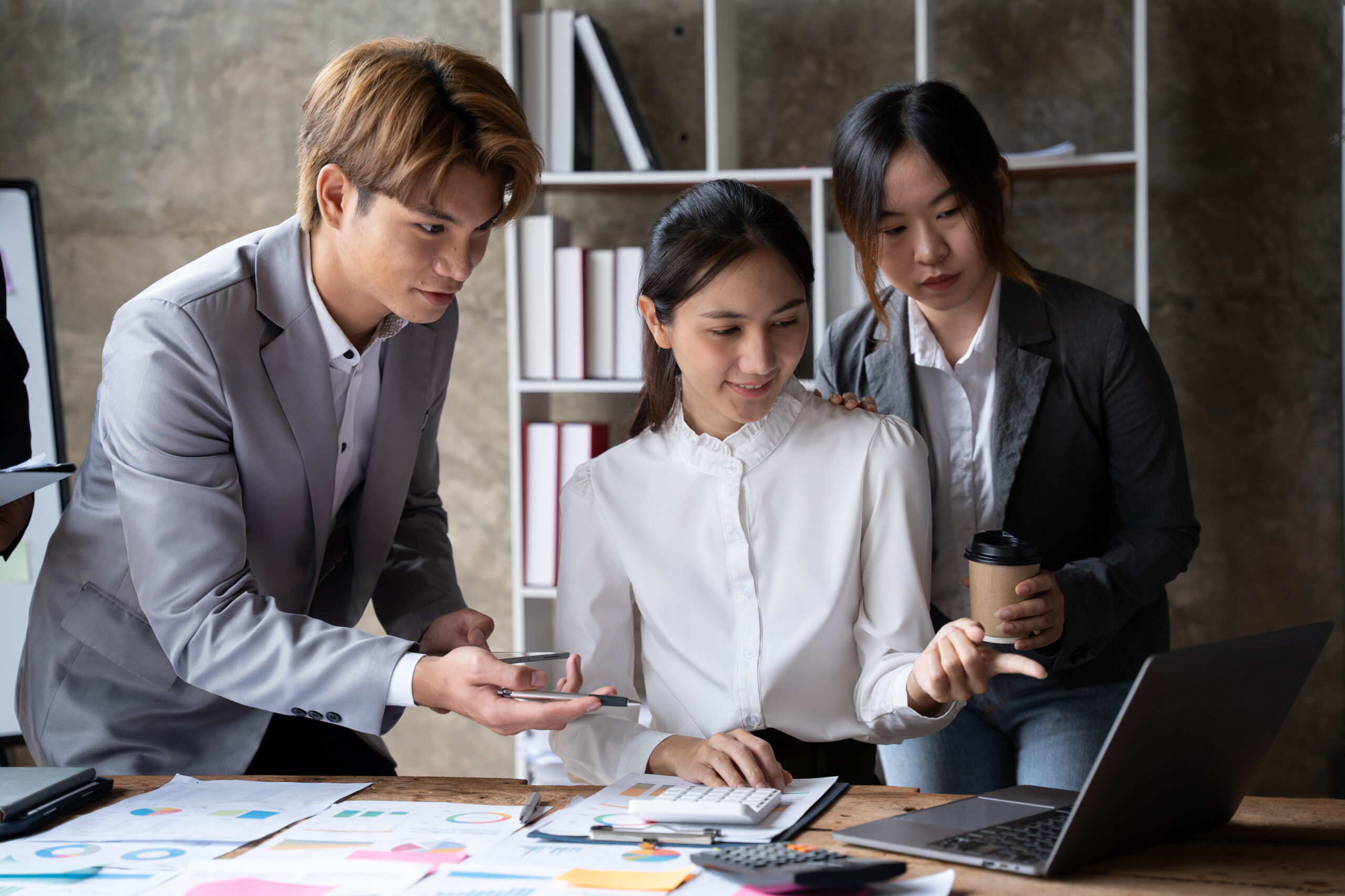 Business People Meeting to analyse and discuss and brainstorming the financial report chart data in office Financial advisor teamwork and accounting concept.