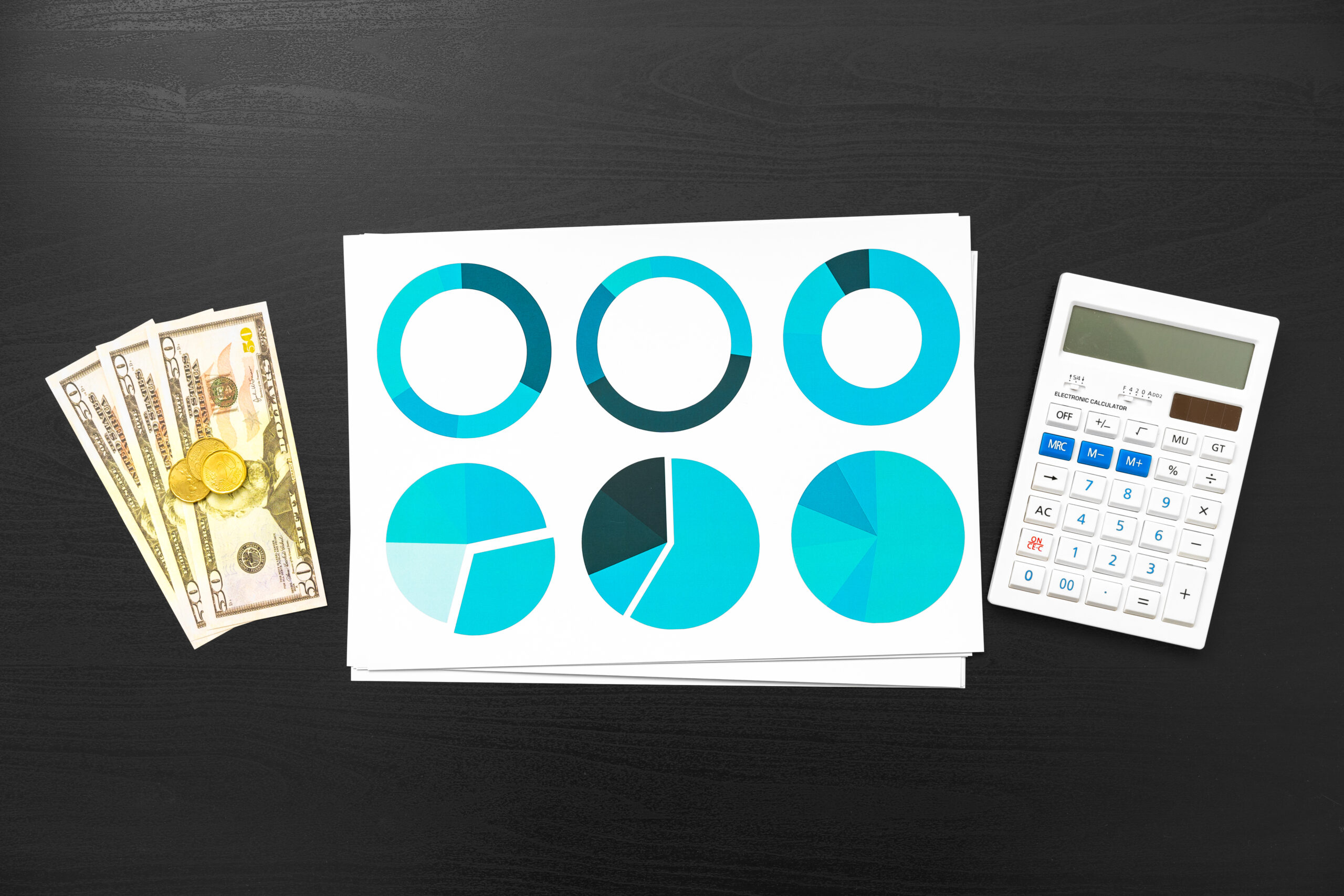Top view of table with financial papers and calculator