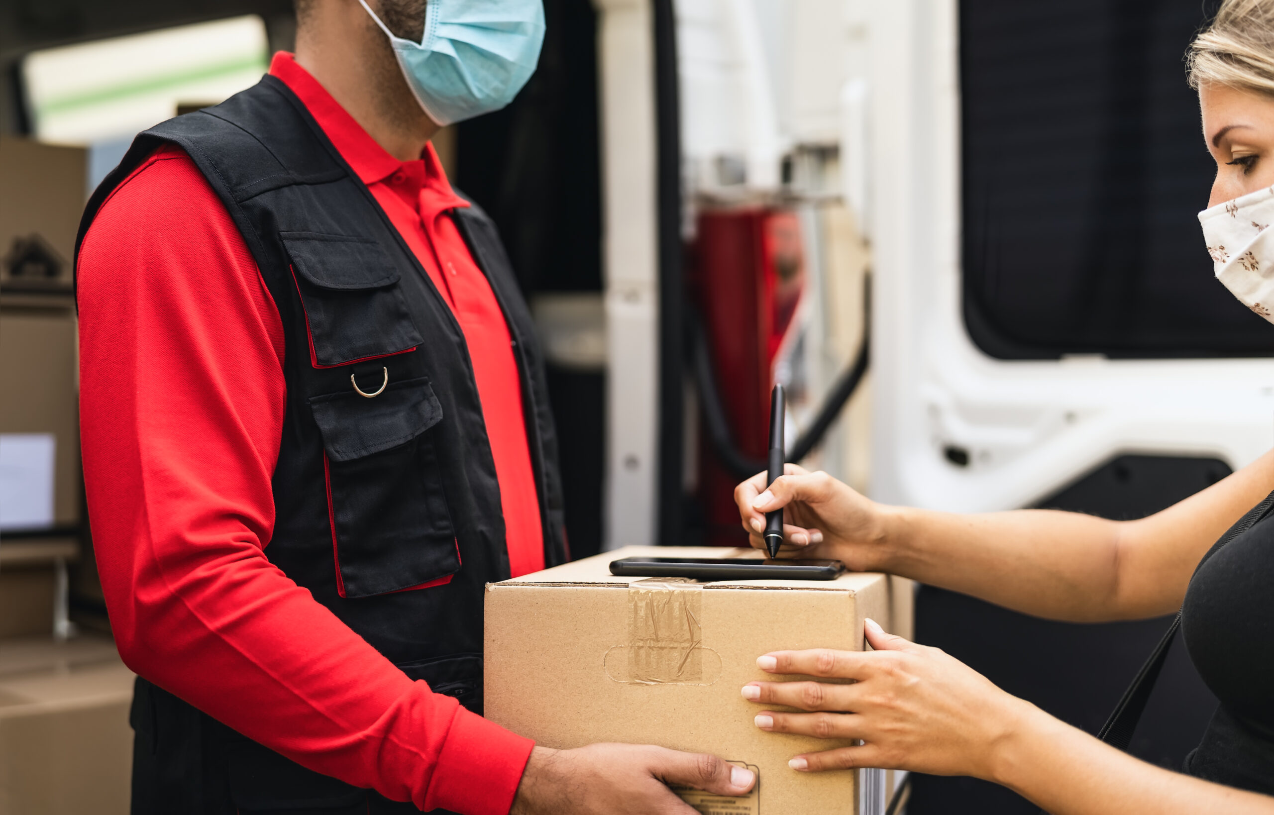 Delivery man wearing face protective mask to avoid corona virus