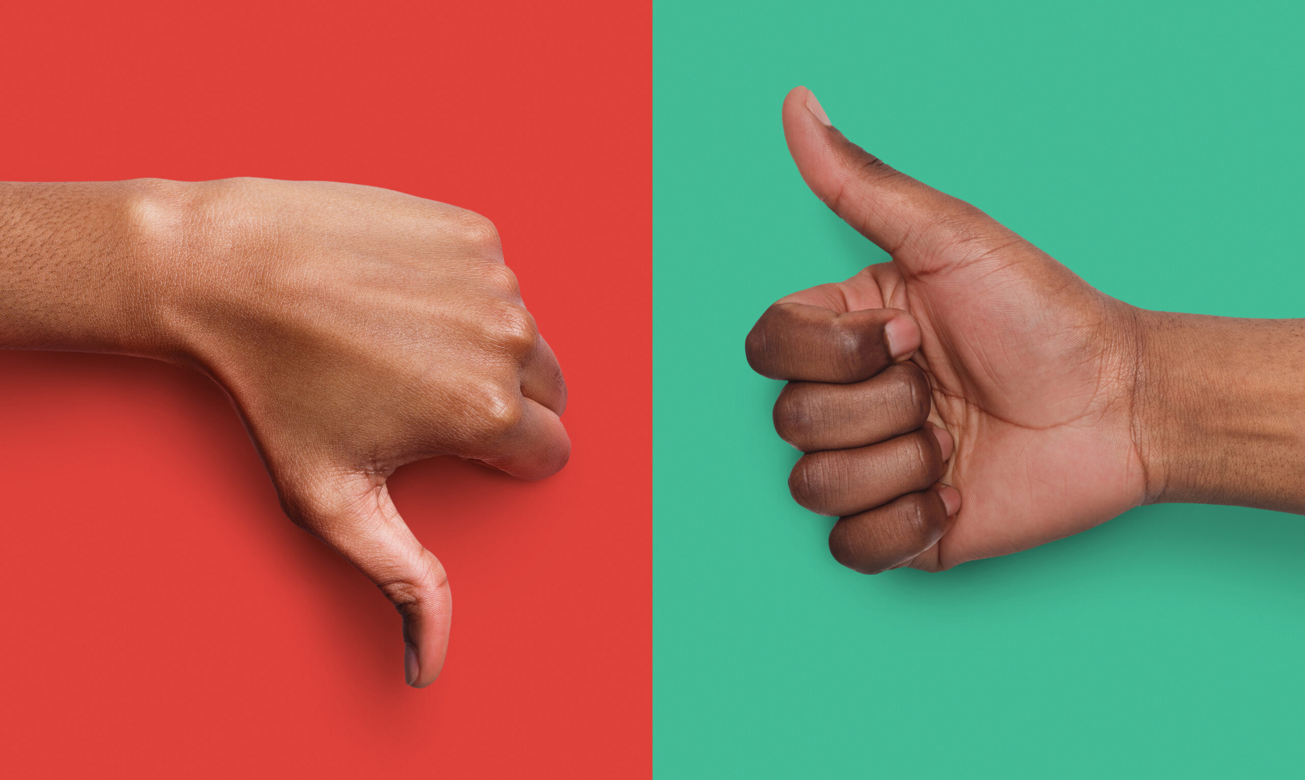 Black hands with thumb up and down gestures